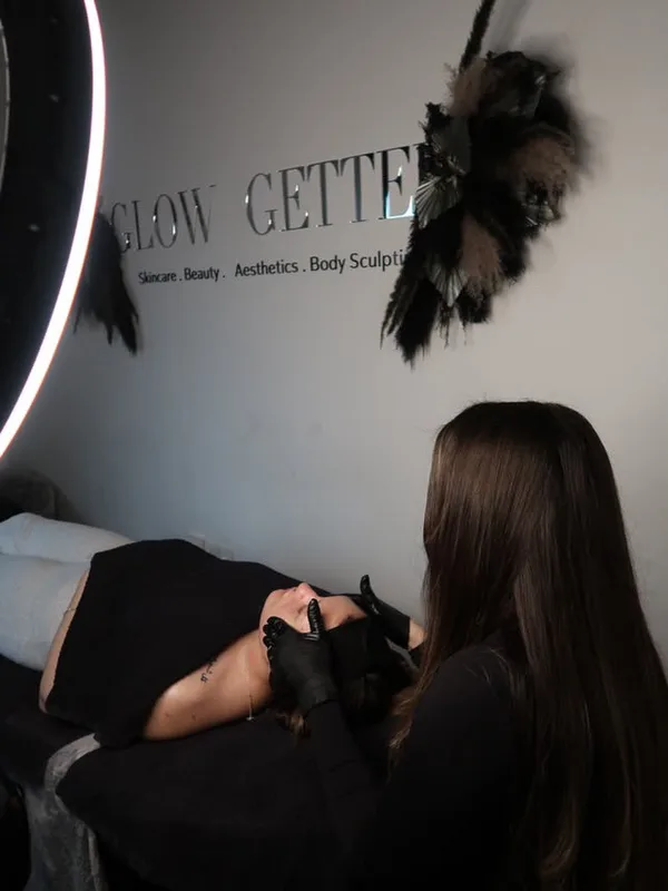 An advanced facial treatment under the ring light in the Glow Getter treatment room